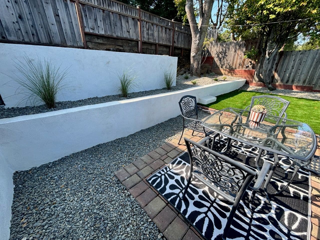 Project Cozy Patio Area with Retaining Walls and Turf image