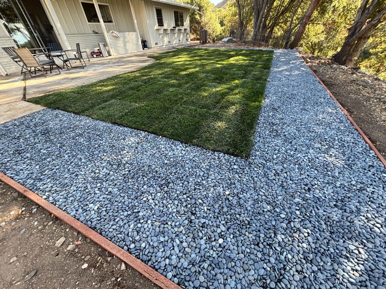 Backyard Escape with Fresh Lawn and Hardscape Magic image